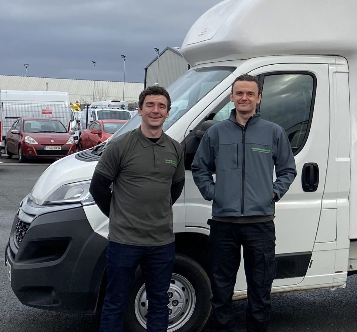 Team stood outside of van image 1