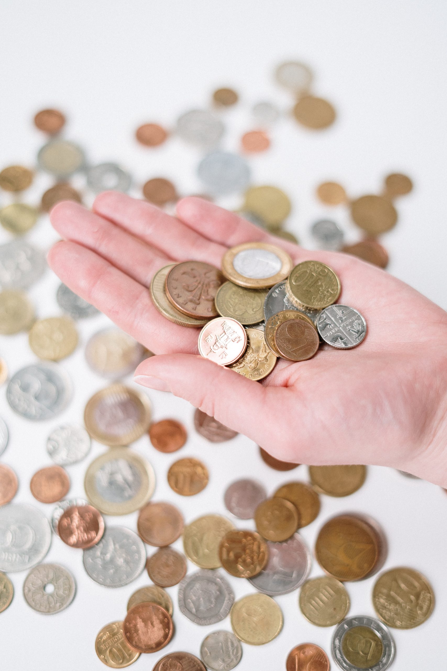 hand holding coins