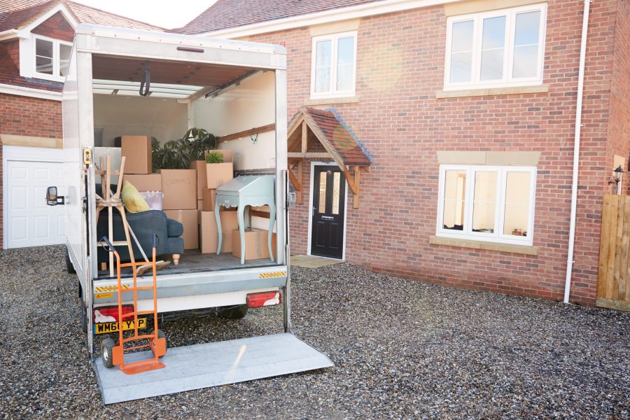 Removal,Truck,Waiting,To,Be,Unloaded,Outside,New,Home,On