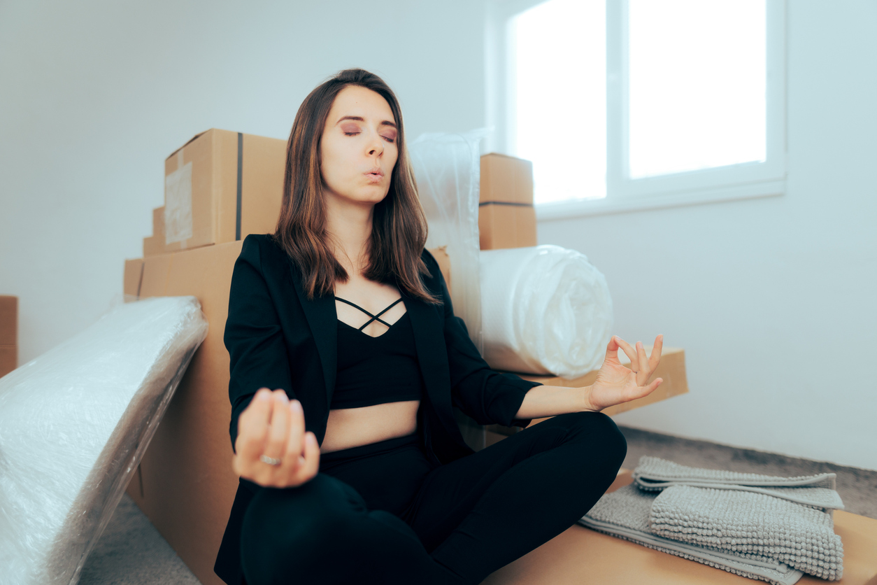 Woman Trying to Relax and Reduce the Stress of Relocating